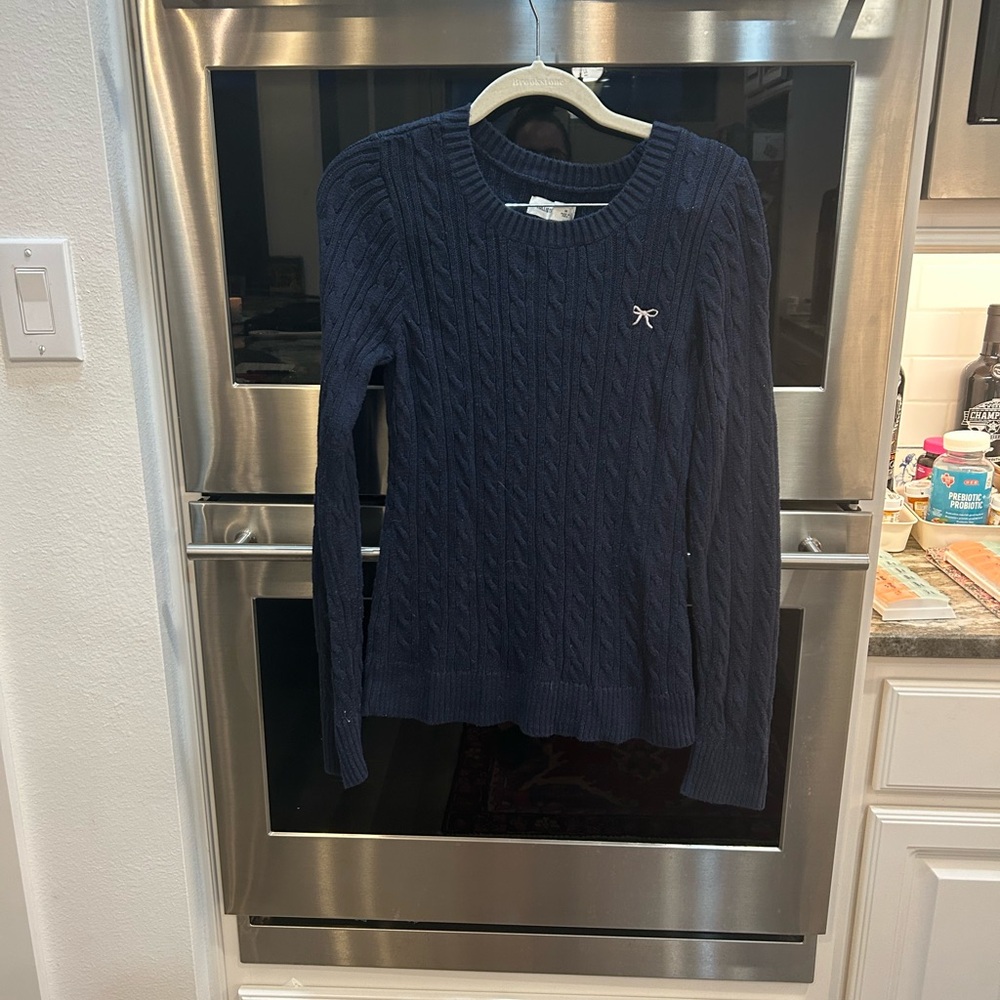Hollister Navy Cable Knit Sweater with bow detail size M has hole in back